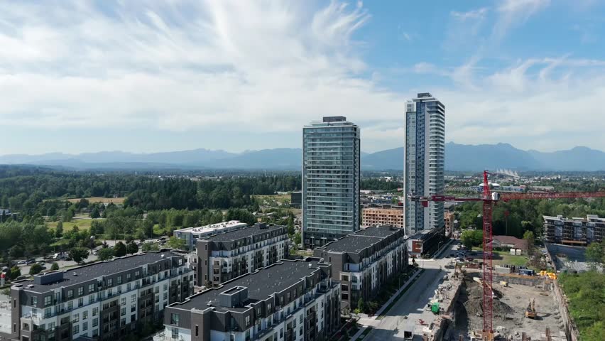 Condominium And Apartment Complex With Modern Architecture In Langley, BC, Canada. - aerial shot