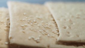 Taste of crunchy snacks with sesame seeds layered on crispy crackers - Powered by Shutterstock - Get 15% off with code: PIKWIZARD15