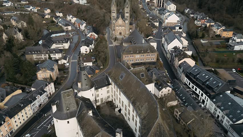 Drone footage of Clervaux in Luxembourg showing the castle and the church