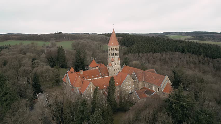 Drone footage of Clervaux in Luxembourg showing the abbey