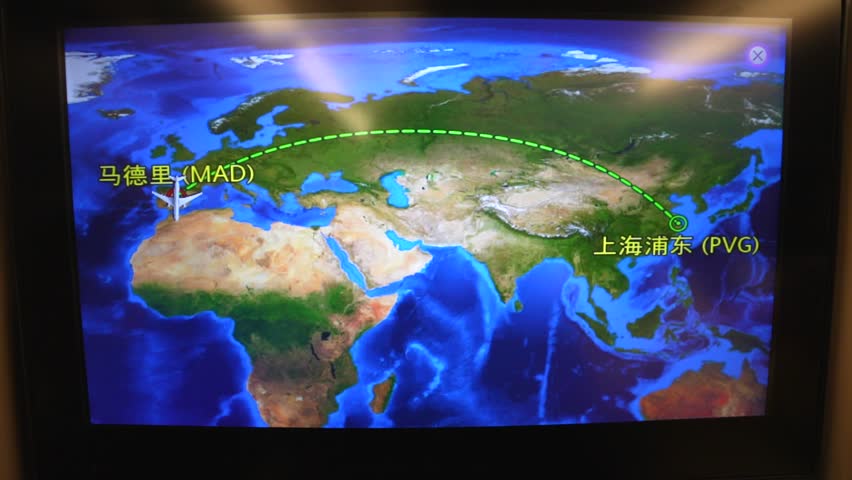 Seat screen map with Chinese characters showing the trip from Madrid to Shanghai Pudong Airport