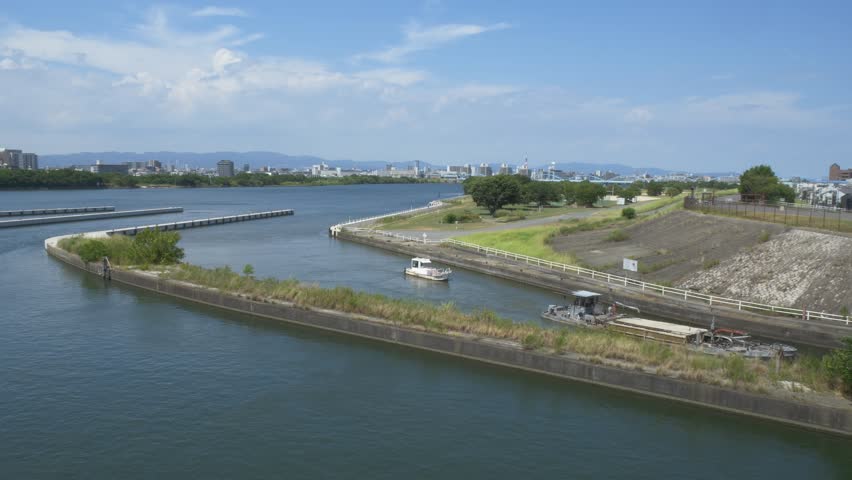 Barge And Tug Boat Entering The Kema Lock Gate By Yodo River In Osaka, Japan. - wide shot