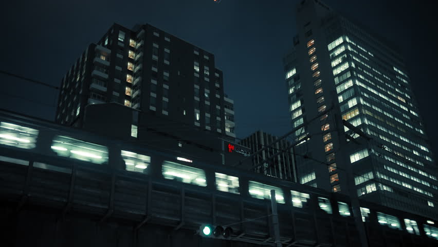 Tokyo Night Cityscape with Traffic Light, Train, and Illuminated Buildings