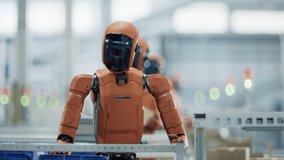 Autonomous AI-Enabled Humanoid Robots Work at Fulfillment Center.  Automated Warehouse or Logistics Center with Advanced General Purpose Robots. Human Like Robots Work in Industrial Environment - Powered by Shutterstock - Get 15% off with code: PIKWIZARD15