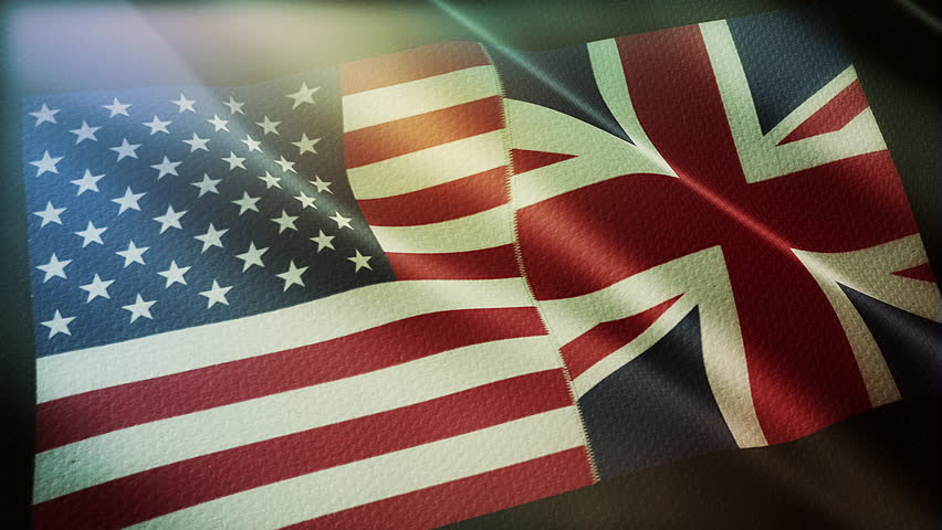 The diagonal and stitched-aligned combined USA and United Kingdom flags are waving in the wind. Concept of Strategic negotiation, national relationship, Conflict, and War. 