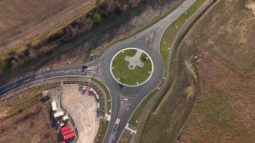 Rural highway roundabout easing congestion in English infrastructure layout, Waddesdon A41 road