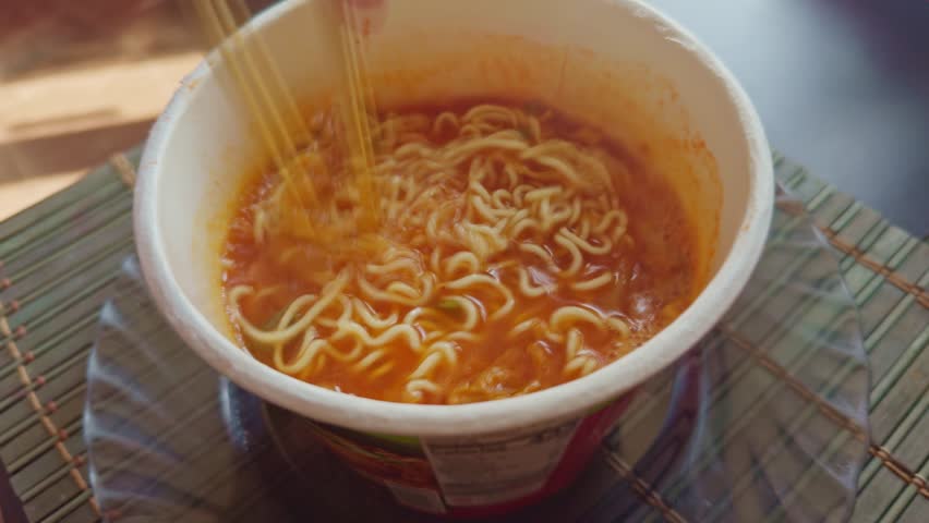 Instant Rice Noodles Bowl. Chinese Ramen Soup. Cooked Rice Instant Glass Noodles Ramyeon Bowl. Asian Dinner Cooking. Quick Ramen Dry Vegetables. Chinese Food. Korean Ramyeon Bowl Glass Noodles 