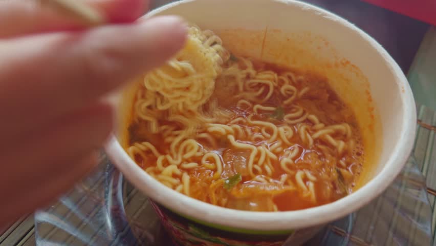 Instant Rice Noodles Bowl. Chinese Ramen Soup. Cooked Rice Instant Glass Noodles Ramyeon Bowl. Asian Dinner Cooking. Quick Ramen Dry Vegetables. Chinese Food. Korean Ramyeon Bowl Glass Noodles 