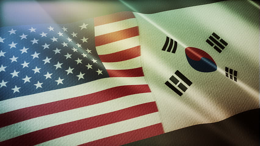 The diagonal and stitched-aligned combined USA and South Korea flags are waving in the wind. Concept of Strategic negotiation, national relationship, Conflict, and War.