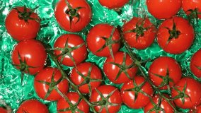 Ripe Tomatoes in Clear Water. Top View Slow Motion Splash. - Powered by Shutterstock - Get 15% off with code: PIKWIZARD15