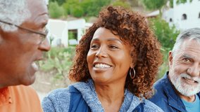 Close Up Of Group Of Senior Friends On Hike In Countryside Talking And Laughing Together - Powered by Shutterstock - Get 15% off with code: PIKWIZARD15