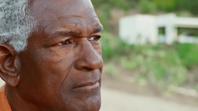 Close Up Portrait Of Serious African American Senior Man Outdoors In Countryside - Powered by Shutterstock - Get 15% off with code: PIKWIZARD15