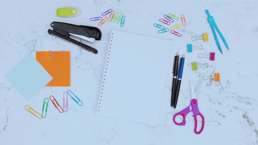 Inspirational back-to-school motivational quote appearing in stop motion with notebooks, pencils, and stationery on background. Perfect for education, learning, school projects, and student motivation