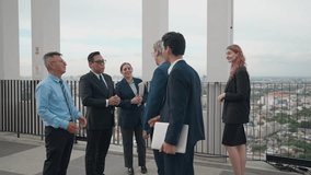 Diverse Group of Business Professionals Meeting and Engaging in Discussion, Sharing Ideas and Exploring Collaboration Opportunities for Business Growth on Rooftop of Modern Building City - Powered by Shutterstock - Get 15% off with code: PIKWIZARD15