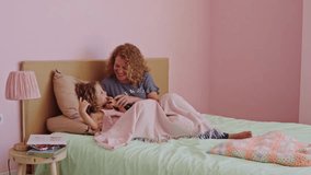 Mother and daughter sharing intimate moments in slow motion - Powered by Shutterstock - Get 15% off with code: PIKWIZARD15