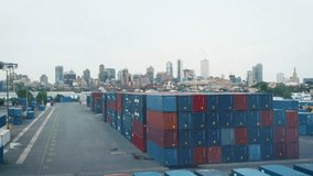 A stunning aerial shot visualizes the future of logistics. This VFX concept shows a smart port with containers being scanned by automated technology, and a drone delivering a package.  - Powered by Shutterstock - Get 15% off with code: PIKWIZARD15