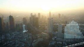 A stunning aerial of a financial district at sunrise. Animated stock market data and graphs show a sudden crash, visualizing an economic crisis, recession, or bear market.  - Powered by Shutterstock - Get 15% off with code: PIKWIZARD15