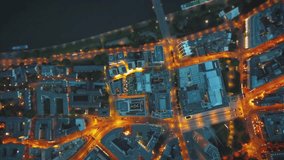 A stunning top-down aerial of a city at night. This futuristic VFX concept visualizes a smart city's transportation network with glowing, high-speed data and traffic light trails. - Powered by Shutterstock - Get 15% off with code: PIKWIZARD15