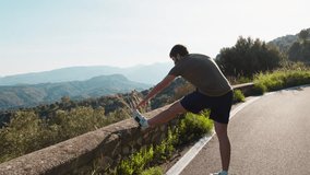 Young Athlete Stretches Legs By The Road After Training - Powered by Shutterstock - Get 15% off with code: PIKWIZARD15