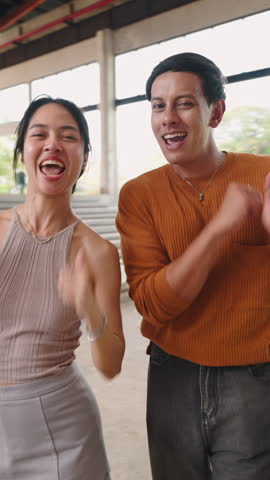 Young man and woman dancing together