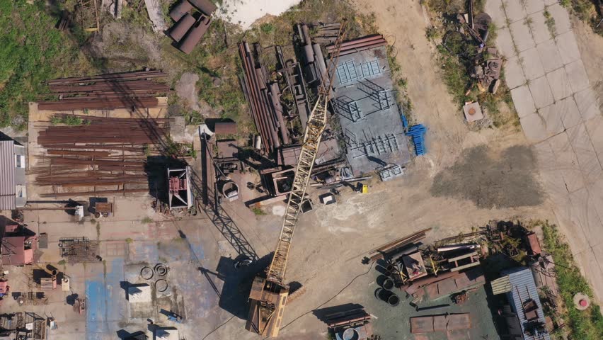 Industrial zone with scrap metal for recycling. Aerial top view from the drone.