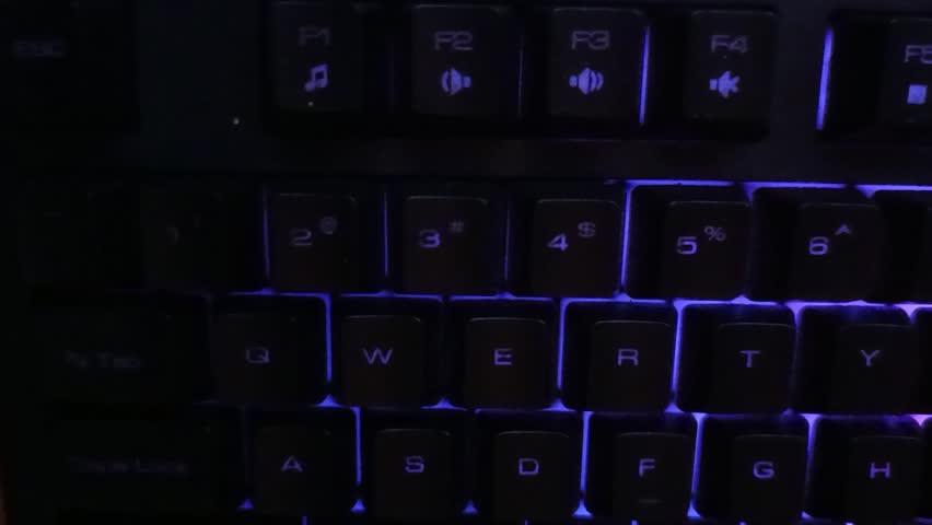 Gaming keyboard with dynamic RGB lighting, showcasing a mesmerizing light wave effect across the keys.