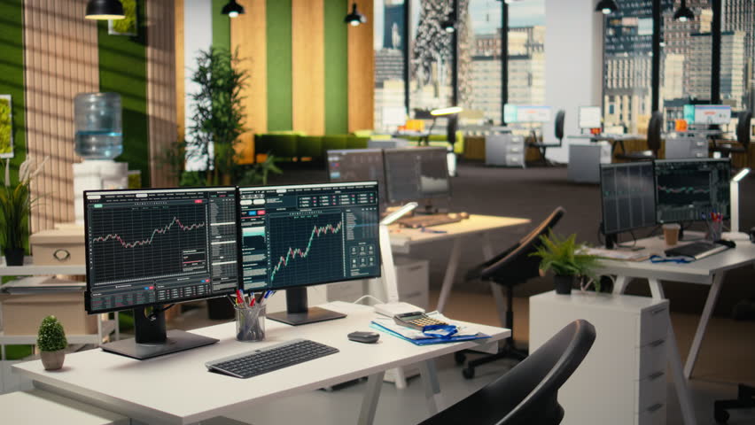 Trading platform on screens used by financial professionals tracking stock market activity using analytical tools. Brokerage company office with price graphs interface on computer displays
