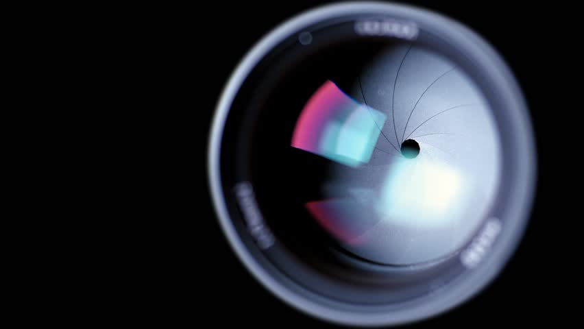 Diaphragm blades of the fixed lens opening and closing aperture f-stop adjustment of a photo camera close-up shot