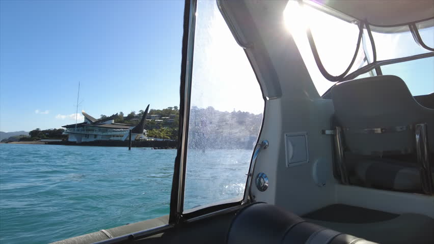 POV from a boat arriving into Hamilton Island Marina harbour, Whitsundays, Australia
