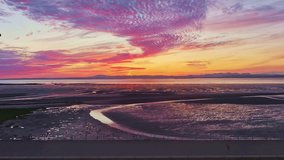 Silhouette of an unidentified man jog in the foreground at Moracombe Bay beach during sunset. Moracombe Bay beach located at Cumbria and Lancashire counties, England, United Kingdom. - Powered by Shutterstock - Get 15% off with code: PIKWIZARD15