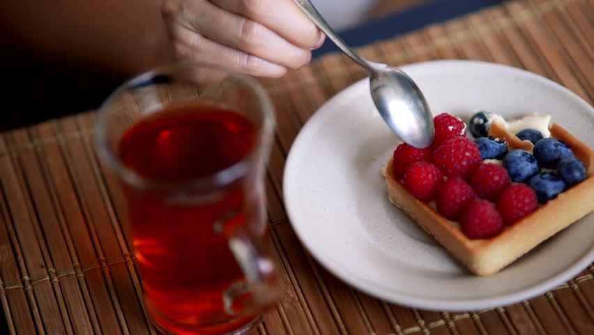 Eating Fruit Tart.  Delicious Dessert With Raspberries And Blueberries. Sweet Pastry. Fruit Tart. Tea And Dessert Break. Enjoying Simple Moment. Sweet Treat Delicious Pastry  Freshly Baked Tart Tasty