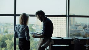 Business Partners Discussing Documents In Office. Professional Teamwork And Collaboration.  Colleagues Reviewing Papers. Business Meeting. Corporate Professionals Working. Discussing Plans Strategy - Powered by Shutterstock - Get 15% off with code: PIKWIZARD15