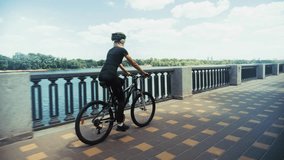 Woman Riding Bicycle. Female Cyclist With Helmet. Active Lifestyle And Urban Cycling. Training For Fitness. Cycling Exercise. Sporty Woman Physical Activity And Recreation. Bike Ride Cyclist Fitness - Powered by Shutterstock - Get 15% off with code: PIKWIZARD15