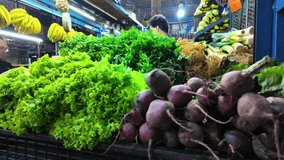 Fresh produce display at Farmer market with leafy greens, bananas and root vegetables. Harvested - Powered by Shutterstock - Get 15% off with code: PIKWIZARD15