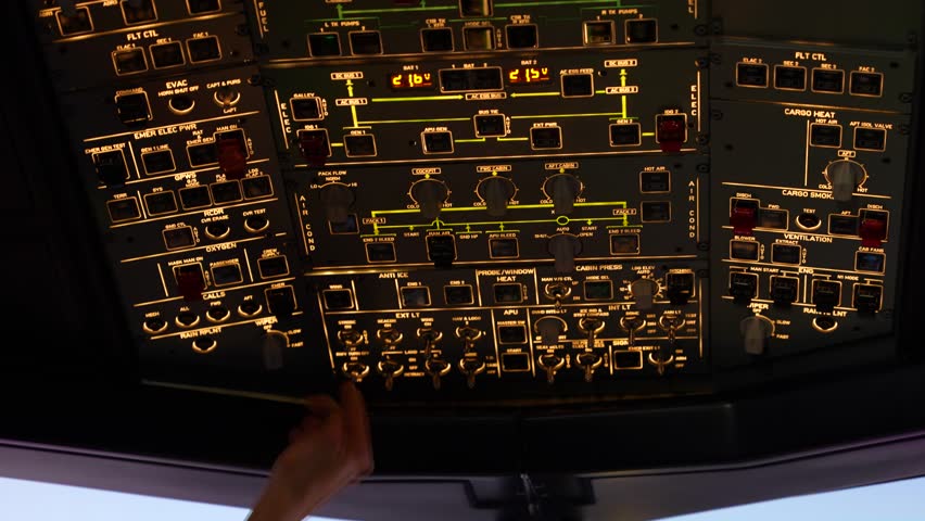 Airbus A320 cockpit toggle controls button interior, pilot making adjustment mid flight