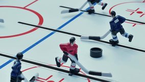Table hockey players competing during a match - Powered by Shutterstock - Get 15% off with code: PIKWIZARD15