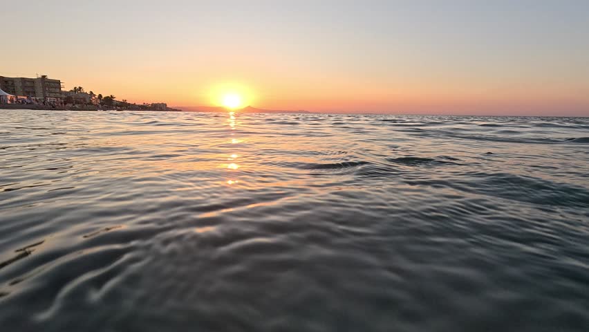 Sunset over the Mediterranean sea in Punta Molins Denia Alicante province Spain