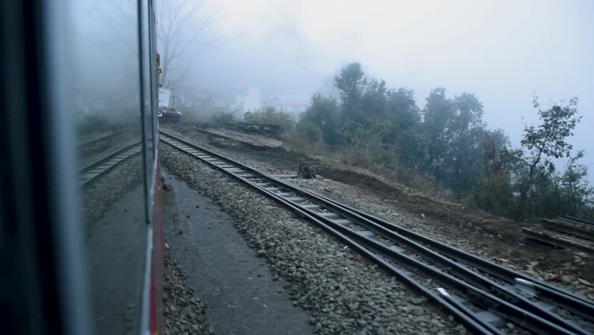 Toy train running from Kalka to Shimla or Simla capital of Himachal Pradesh north India Himalayas. Indian mountain railway