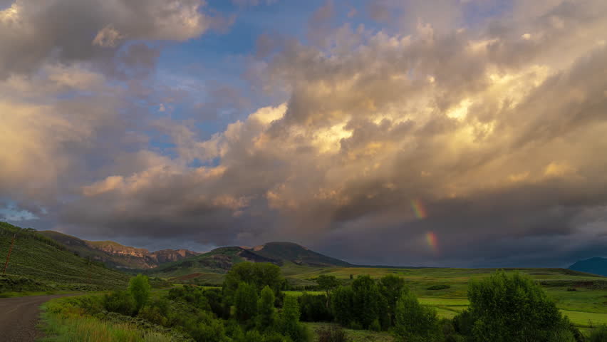 Timelapse, Clouds and Rainbow Over Pristine Landscape in Summer Season