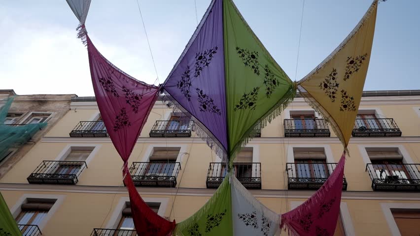 Vibrant Mantones de Manila displayed at La Paloma festival in La Latina, Madrid.