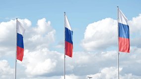 Russian flags waving in the wind on a beautiful cloudy day - Powered by Shutterstock - Get 15% off with code: PIKWIZARD15