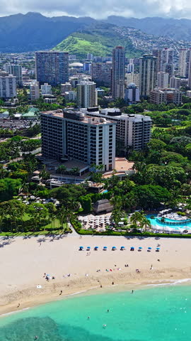 Vertical Aerial View of Honolulu, Hawaii USA, Waikiki Beach, Beachfront Hotels, Condominiums and Park on Hot Sunny Day