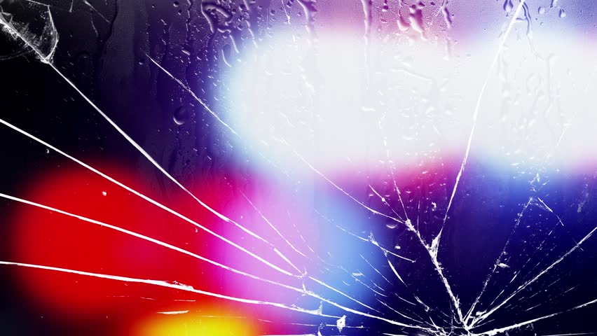 Cracked glass with raindrops and flashing police lights. Shattered glass with pulsating red and blue police lights and rain streaks. Abstract background for crime, emergency, danger, urban drama,vfx