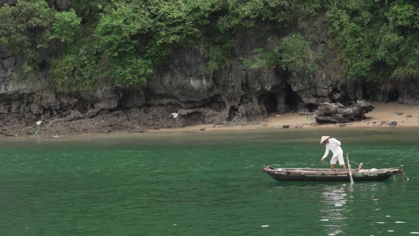 Cat Ba Town , Vietnam - 08 04 2025: Lan Ha Bay Cat Ba Island traditional Vietnamese fishing boat Southeast Asia