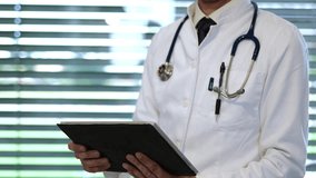 Doctor using tablet and AI to upload patient health medical data record to cloud - Powered by Shutterstock - Get 15% off with code: PIKWIZARD15