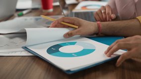 Diversity business team in office discuss papers diagram data financial startup growth marketing result sales trading documents talking multiracial four colleagues informal businesspeople in boardroom - Powered by Shutterstock - Get 15% off with code: PIKWIZARD15