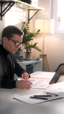 Architect Working In Office. Draws With Pen Or Tools On Tablet. Business Portrait Of Handsome Business Man Wearing Eyeglasses Sitting At Workplace. Confident Businessman Became Successful. Business