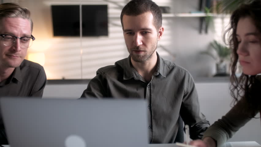 Colleagues And Clients Talking Strategy With Laptop And Tablet. In Creative Office Productive Coworkers Sitting At The Table For Company Meeting. Teamwork And Social Concepts - Powered by Shutterstock - Get 15% off with code: PIKWIZARD15