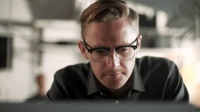 Business Man Entrepreneur Typing On Laptop Doing Research. Glass Reflection. Young Male Professional Using Computer Sitting At Office Desk. Busy Worker Freelancer Working On Notebook Device. - Powered by Shutterstock - Get 15% off with code: PIKWIZARD15