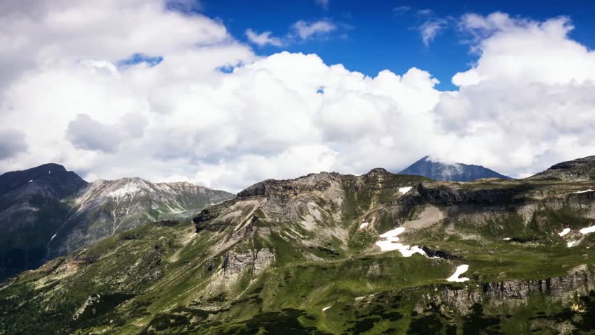 Beautiful mountain landscape with blue sky and clouds in the austrian alps